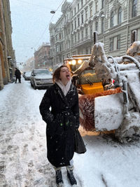 Woman with umbrella in snow