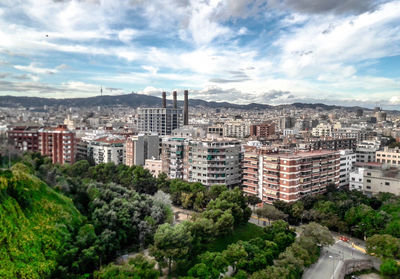 High angle view of buildings in city against sky