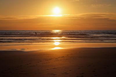 Surfing at sunset