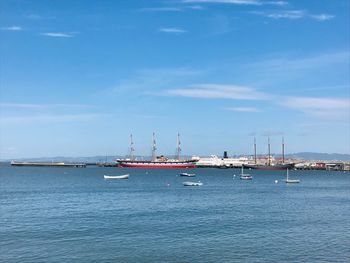 Sailboats on sea against sky