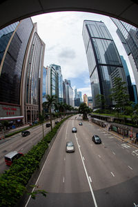 City street and modern buildings against sky