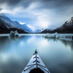 Kayak on lake in mountains in winter
