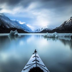 Scenic view of lake with mountains in background