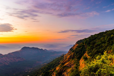 Scenic view of mountains against sky during sunset