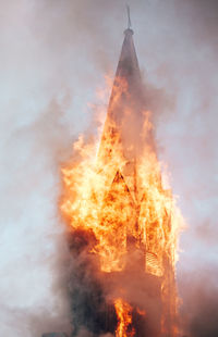 Low angle view of fire against sky