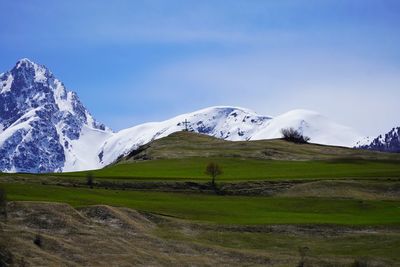 Scenic view of snowcapped mountains against sky