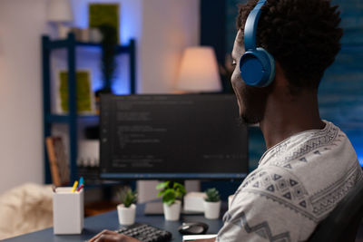 Smiling professional using computer at office