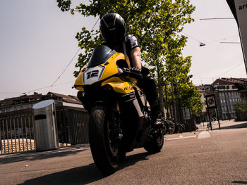 Man riding motorcycle on road