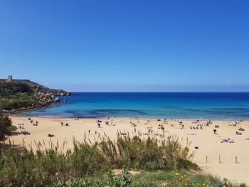 Scenic view of sea against clear blue sky