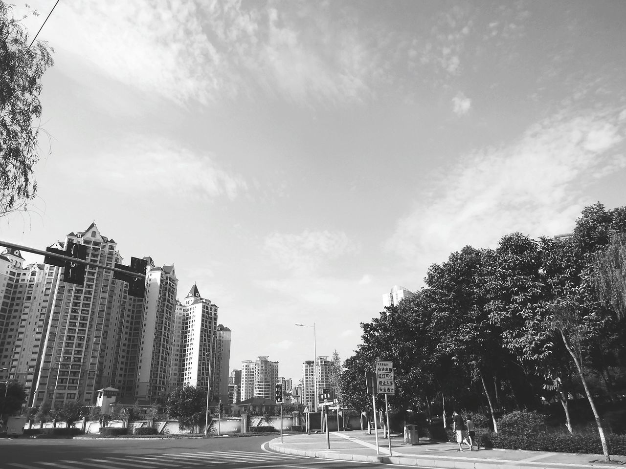 building exterior, architecture, sky, built structure, city, tree, car, land vehicle, street, outdoors, street light, road, transportation, day, no people, nature