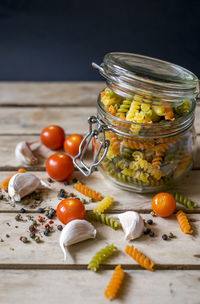 Close-up of pasta in glass jar on table