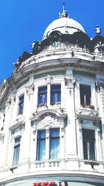 Low angle view of building against blue sky