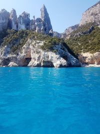 Scenic view of sea against clear blue sky