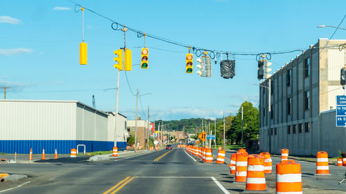Cars on street against clear sky
