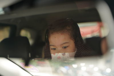 Portrait of girl in car