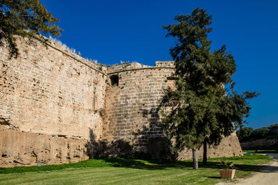 Old ruins against clear blue sky