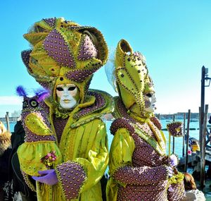 People wearing venetian mask at carnival