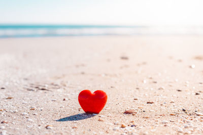 Close-up of heart shape on beach