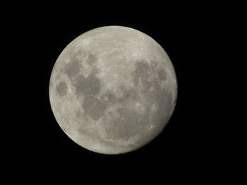 Low angle view of moon against clear sky at night