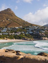 Scenic view of lake against cloudy sky