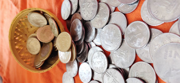 High angle view of coins on table