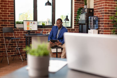 Businessman using digital tablet in office