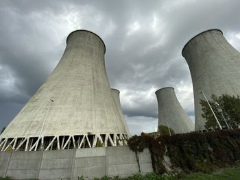 Low angle view of smoke stack against sky