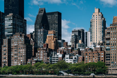 Modern buildings in city against sky