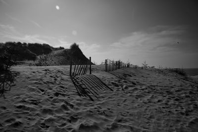 Scenic view of beach against sky during sunset