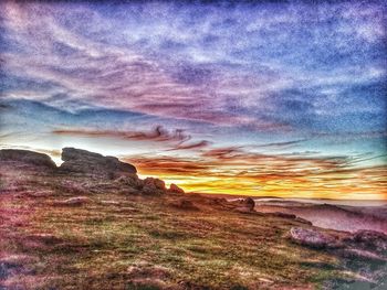 Scenic view of dramatic sky over land