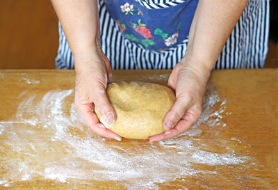 Midsection of woman preparing food