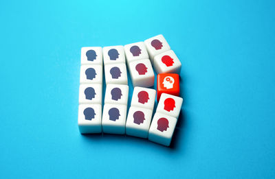 Directly above shot of dices on blue background