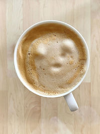 Directly above shot of cappuccino on table