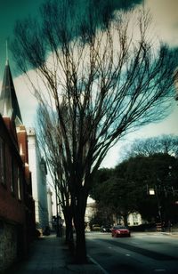 Empty road along buildings