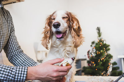 Close-up of man holding dog