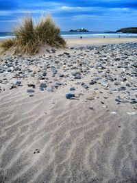 Scenic view of beach against sky