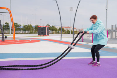 Low angle view of man exercising on field