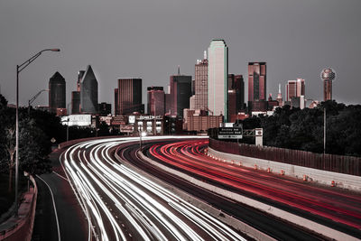 High angle view of light trails on highway in city