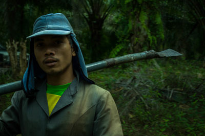 Portrait of young man in forest