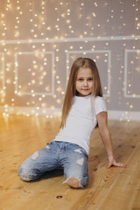 Portrait of cute girl on floor at home