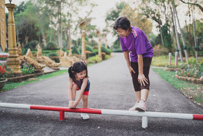 Side view of young man exercising in park