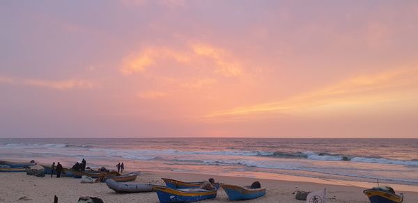 Scenic view of beach against sky during sunset