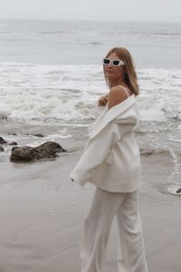 Young woman standing at beach