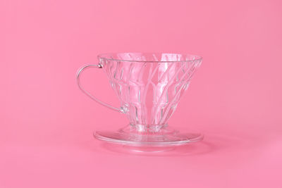 Close-up of cup on pink background