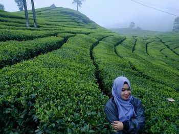 Woman standing in field