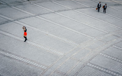 High angle view of people walking in city