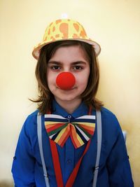 Portrait of woman wearing mask against white background