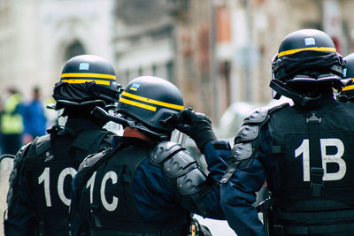 Rear view of police in uniforms