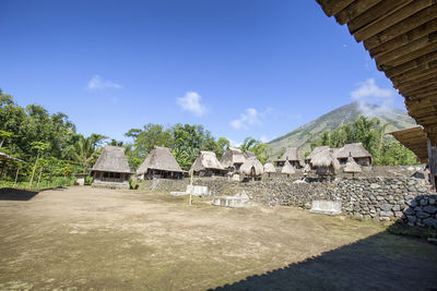 Houses in park against sky