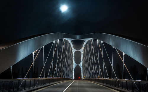 Rear view of bridge against sky at night